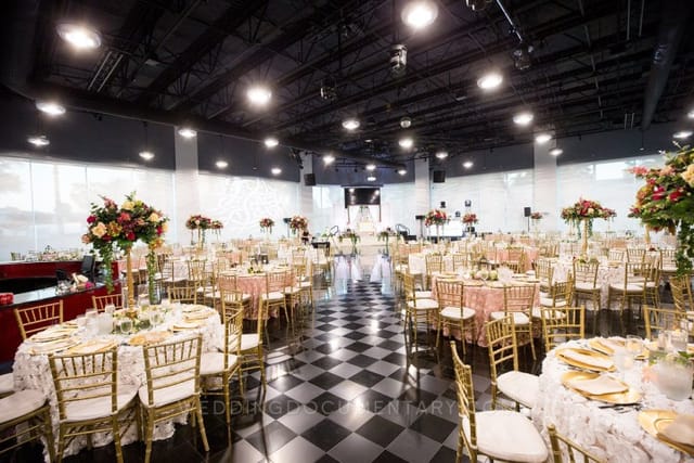 Elegant ballroom with floral centerpieces, ideal for weddings and formal events.