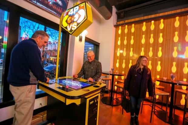 Strikers Lounge in San Pedro Social: vibrant arcade for networking and team-building events.