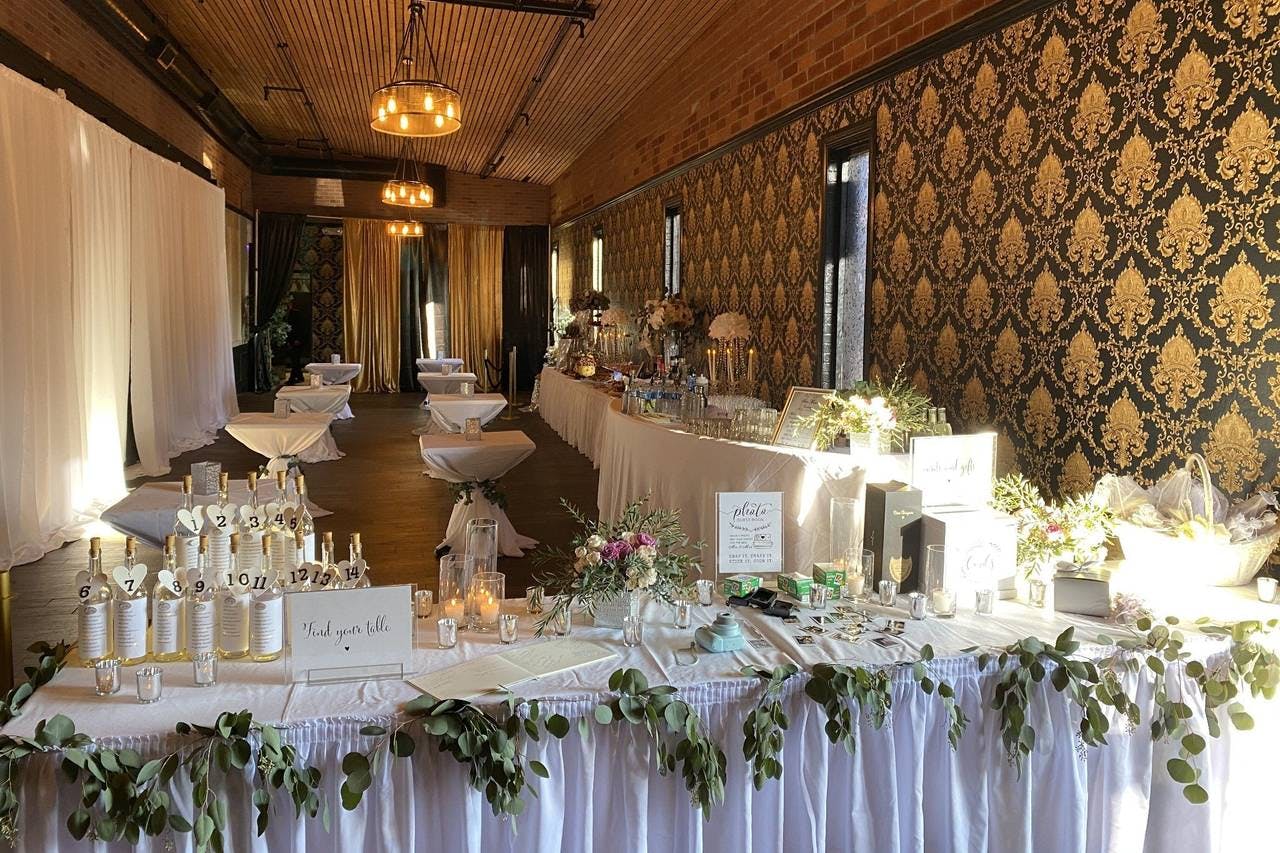 Elegant banquet hall with white linens, perfect for weddings and upscale events.