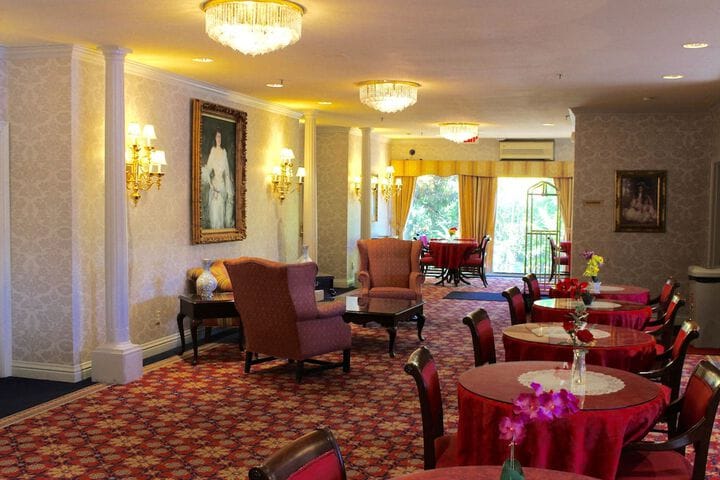 Regal Lobby at Carlyle Hotel: elegant event space with red tablecloths for receptions.