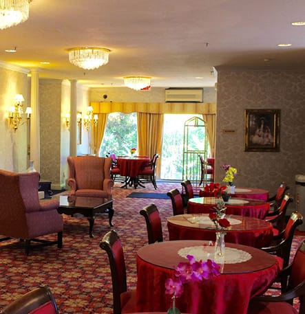 Regal Lobby at Carlyle Hotel: elegant event space with round tables for gatherings.