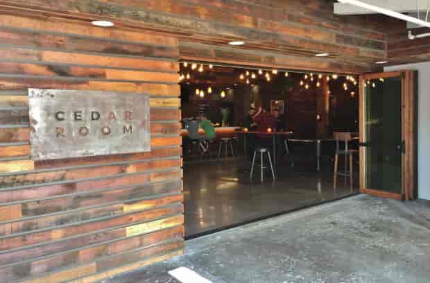 Cedar Room event space with rustic design, ideal for meetings and gatherings.