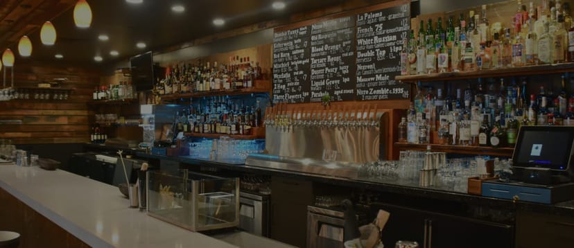 Cedar Room bar with extensive spirits selection, ideal for networking events and gatherings.