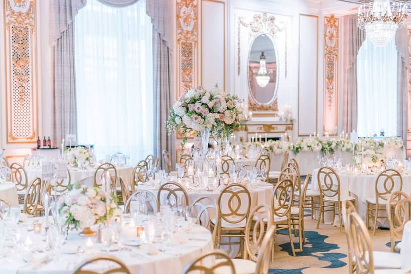 Elegant event space with round tables, ideal for weddings and corporate events.