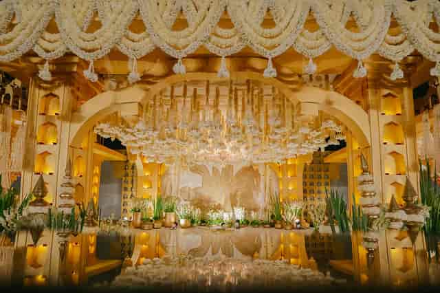 Luxurious wedding venue with floral drapery and elegant lighting for high-profile events.