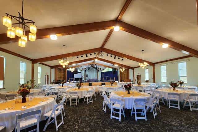Cozy Cottages banquet venue with round tables, ideal for events and conferences.