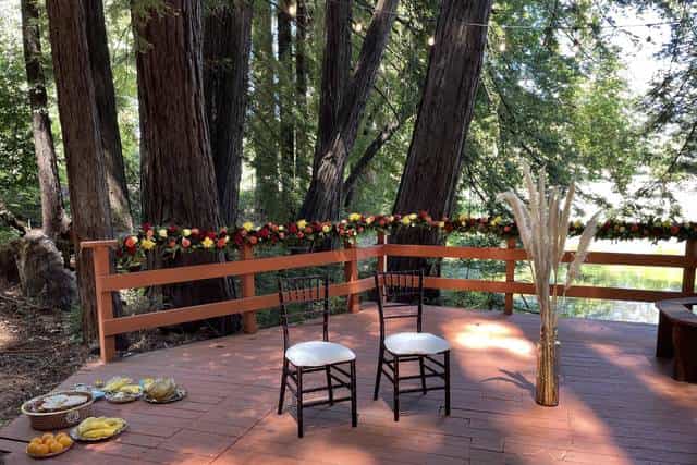 Cozy Cottages outdoor event space with elegant chairs, perfect for weddings and retreats.
