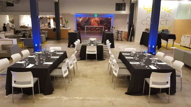 Elegant conference room set for formal dinner at Palo Alto Event Center.