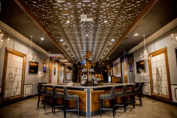 Elegant Bistro event space in Palo Alto with sophisticated bar and chandeliers.