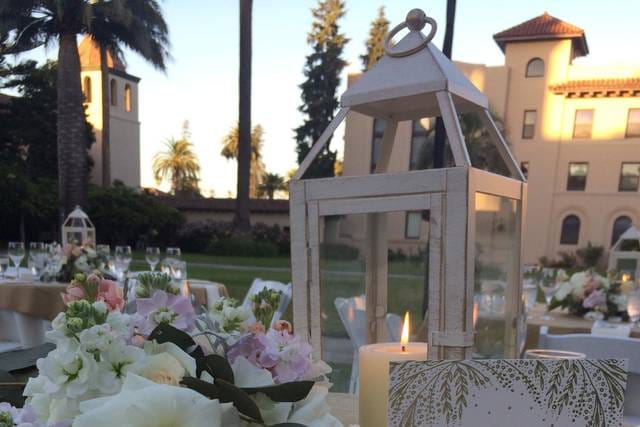 Elegant outdoor event space at Adobe Lodge with floral centerpieces, perfect for weddings.