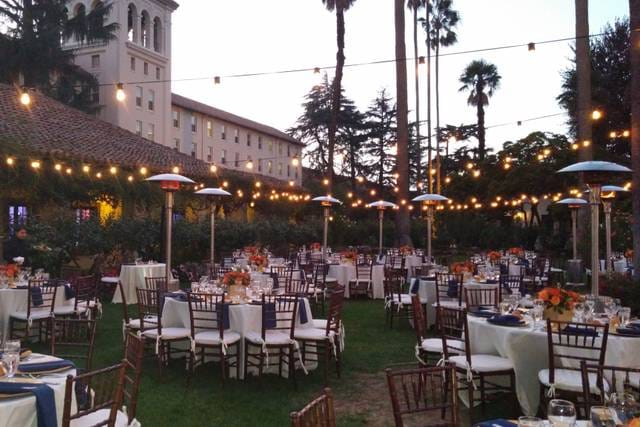 Elegant outdoor event space at Adobe Lodge with string lights, perfect for weddings and gatherings.