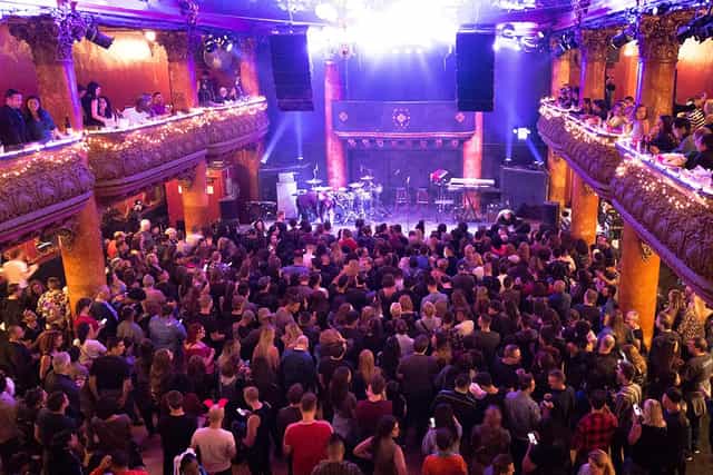 Vibrant Music Hall venue with elevated balconies, perfect for live concerts and events.