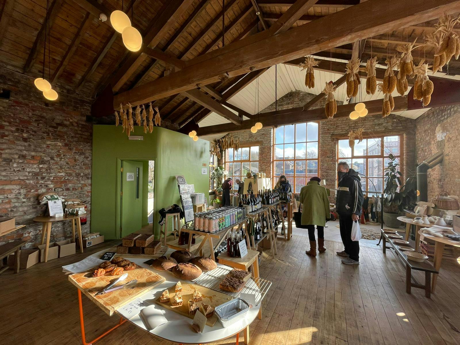 Rustic bakery venue with exposed brick, ideal for workshops and intimate gatherings.