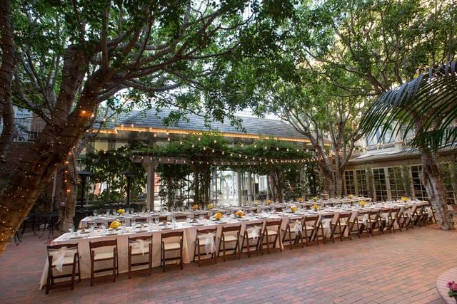 Outdoor courtyard at Horton Grand Hotel with long table, ideal for weddings and events.