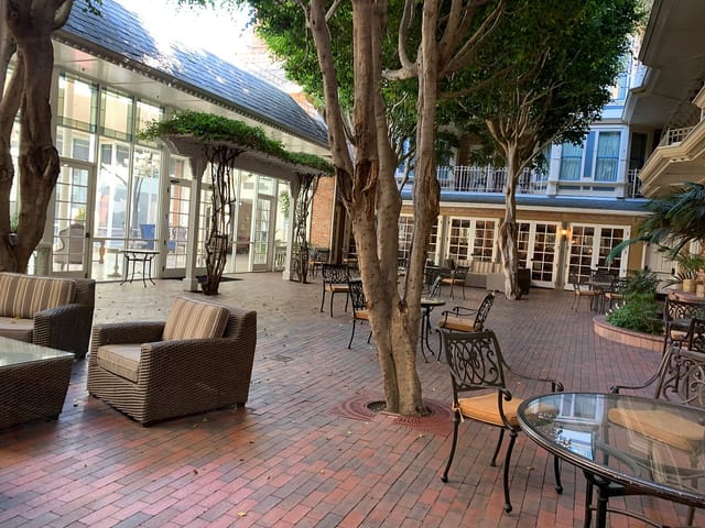 Charming outdoor courtyard at Horton Grand Hotel for casual meetings and networking events.