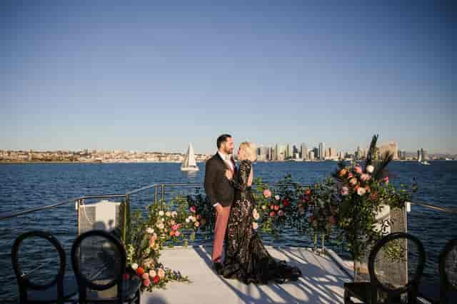 Pendants in Hangar 858: romantic waterfront venue with floral stage for weddings.