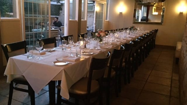 Elegant long dining table at Bellagio Italian Restaurant for intimate gatherings and events.
