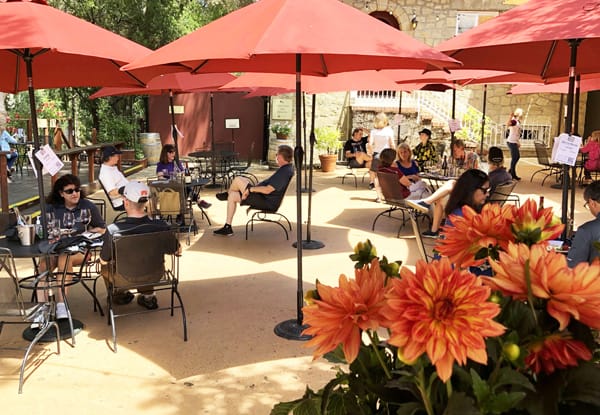 Vibrant outdoor event space at JRS Terrace, Testarossa Winery with colorful umbrellas.