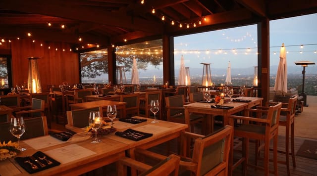 Elegant event space at Izumi Point, featuring wooden tables and stunning vineyard views.