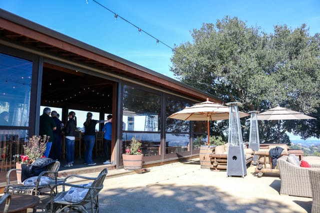 Stylish outdoor tasting room with modern design, ideal for networking events and gatherings.