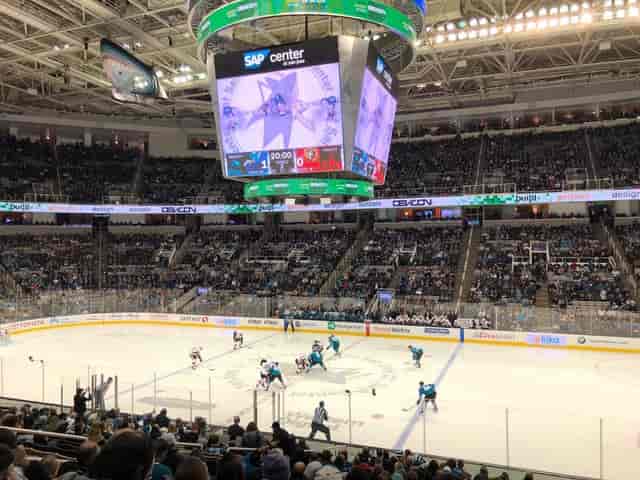 Vibrant arena with fans at PETE BE CENTER for a live sporting event.