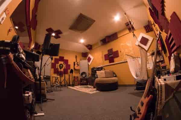 Creative recording studio with vibrant decor, perfect for workshops and meetings.