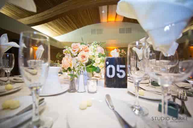 Elegant dining table with pastel flowers for weddings and corporate events.