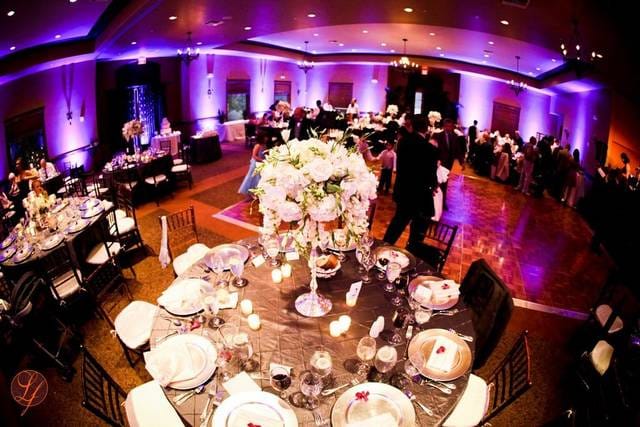 Elegant event space with floral centerpieces, perfect for weddings and corporate events.