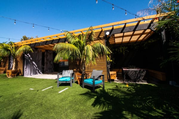 Vibrant outdoor event space at 1835 Studios with modern structure and string lights.