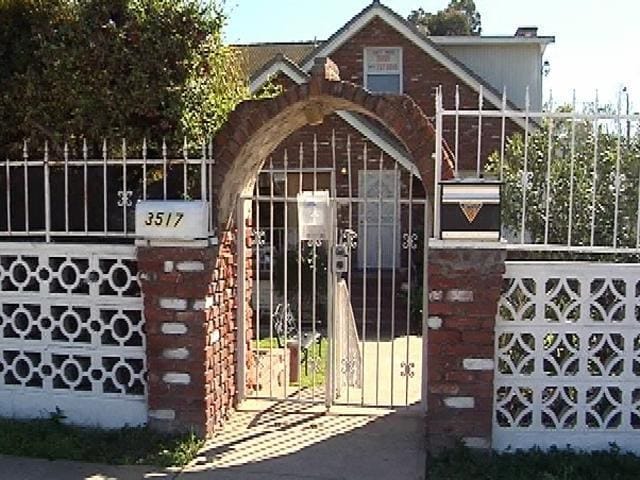Charming entrance with brick gate for intimate outdoor events at Thad's Private Social Club.