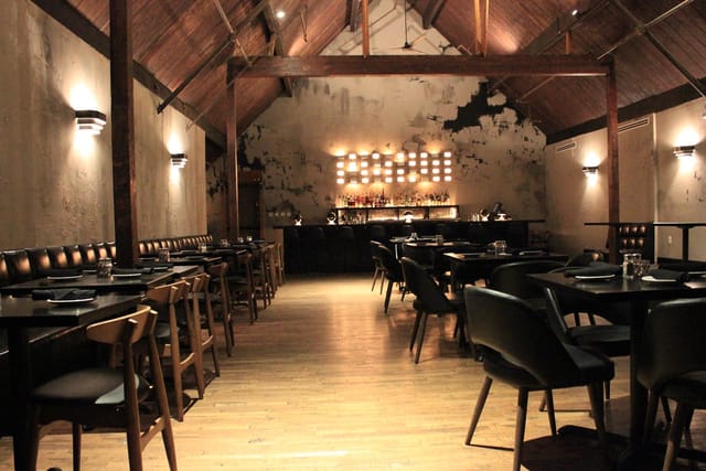 Elegant restaurant patio with rustic charm, ideal for private dinners and corporate events.