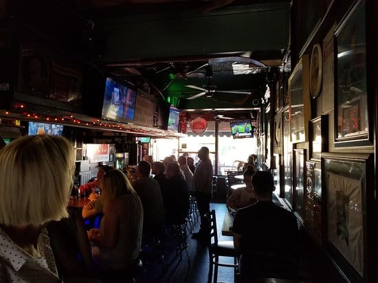 Lively patio at JT's Bar & Grill, ideal for casual networking and team-building events.