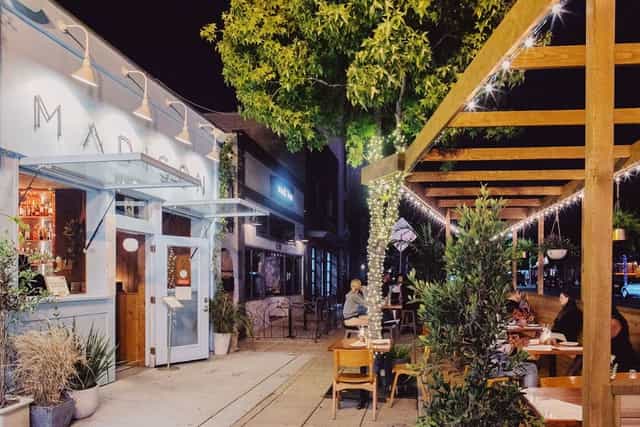 Vibrant outdoor dining patio for casual networking events and gatherings.