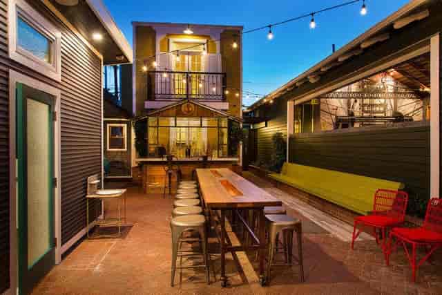 Versatile outdoor event space with string lights for casual gatherings and networking.