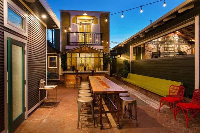 Versatile outdoor event space with string lights for casual gatherings and networking.