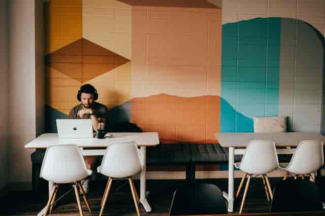 Modern private office with vibrant mural, ideal for creative meetings and collaboration.