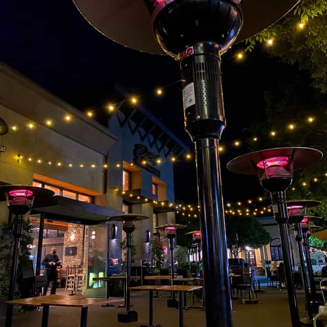 Private room at Willard Hicks Grill, warm outdoor lighting for evening events.