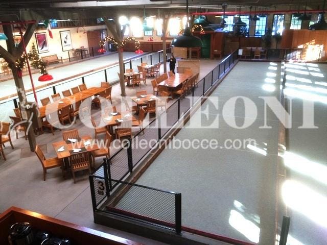 Spacious Campo Di Bocce full bar venue with wooden tables for gatherings and events.