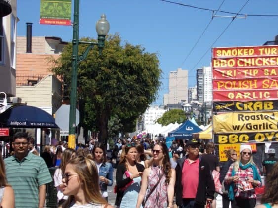 Unity Stage at Union Street Festival with vibrant food stalls and diverse crowd.