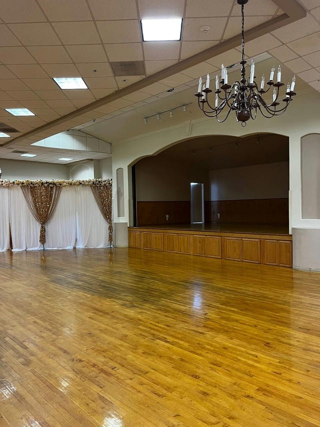 Spacious Newark Pavilion Hall #4 with polished wood floor, ideal for weddings and corporate events.