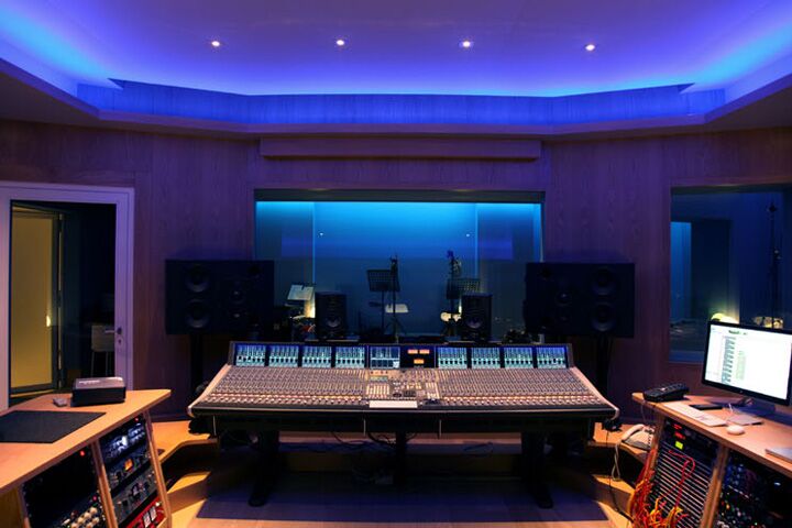 Modern audio control room with advanced equipment for sound production events.