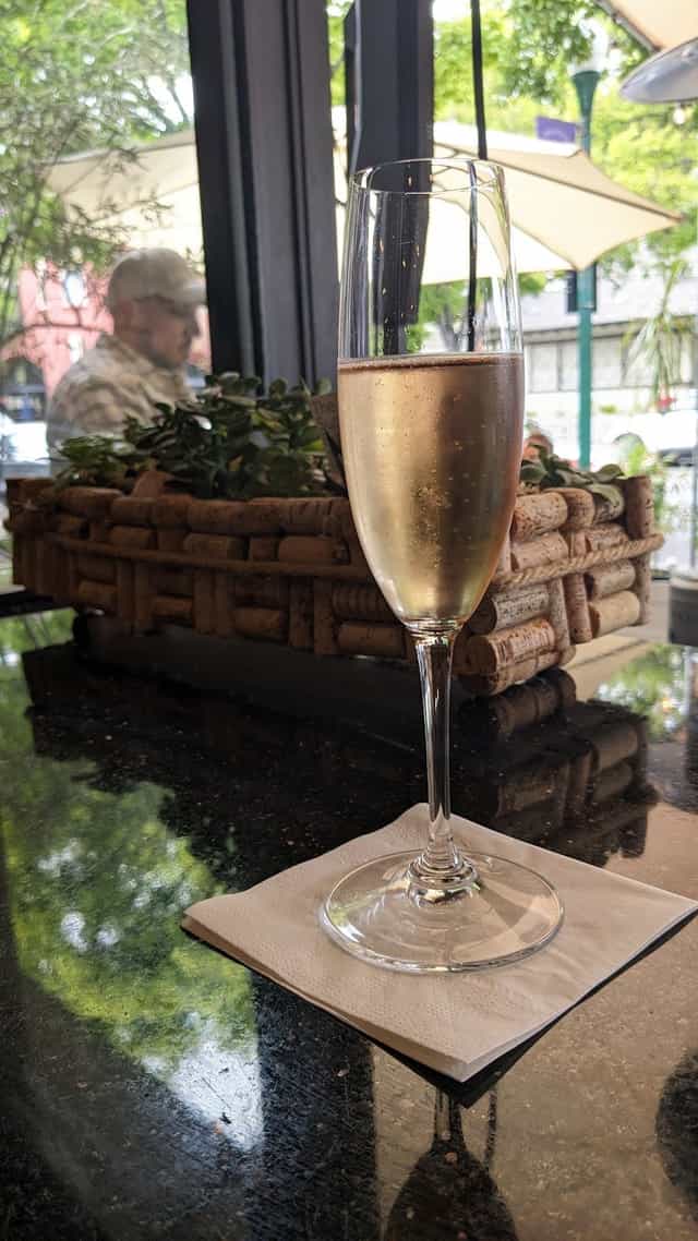 Elegant sparkling wine glass at Tessora's Barra di Vino, perfect for networking events.