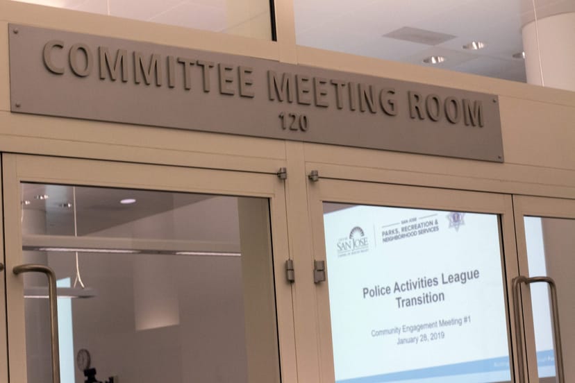 PAL Stadium meeting room in San Jose, featuring clear signage for community events.