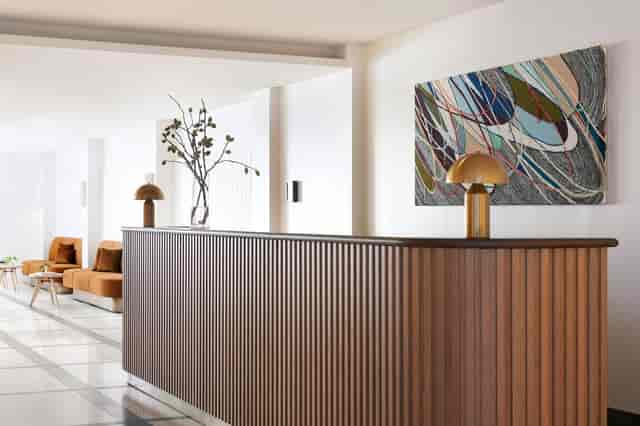Outdoor event space at Kimpton Alton Hotel with elegant wooden reception desk.