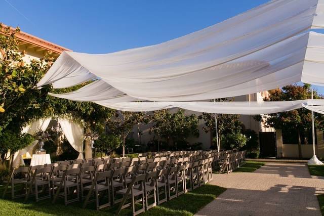 Elegant outdoor event space with drapery, perfect for weddings and corporate events.