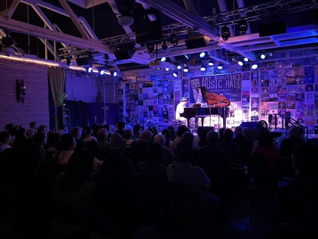 Vibrant event space with warm lighting for live performances and corporate gatherings.