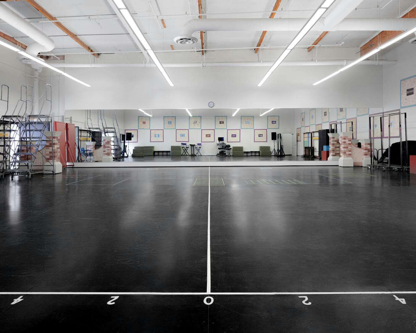 Spacious rehearsal studio with polished floors for workshops and events in San Jose.