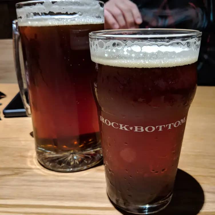 Amber beer pint at Rock Bottom Brewery, perfect for casual networking events.