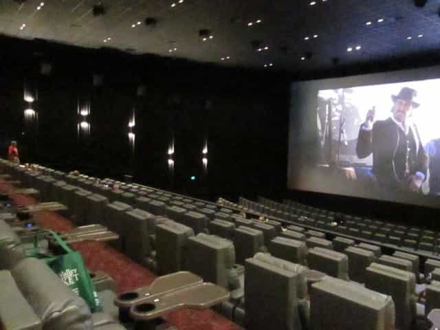 Spacious cinema auditorium with tiered seating for film screenings and corporate events.