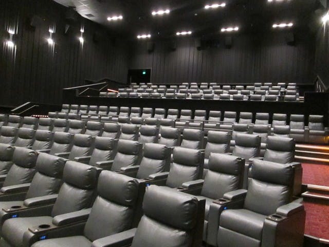Modern theater bar with plush seating, ideal for corporate events and film screenings.